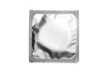 Close up of a pink condom on white background, wrappers in square and rectangle packaging on white...
