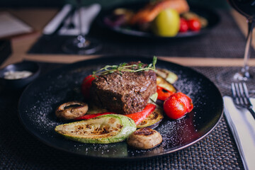 grilled steak with vegetables on plate