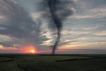 Dangerous whirlwind at agricultural field. Weather phenomenon