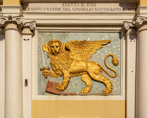 Building with golden bas-relief of lion of the republic of Venice, Vicenza - Italy