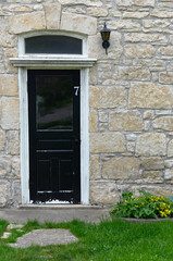 old door in a stone wall, blank stone wall with door, century home