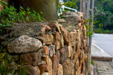 Wall decoration made of tiles, red bricks and stones