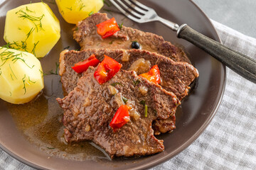 Homemade braised beef with gravy and potatoes