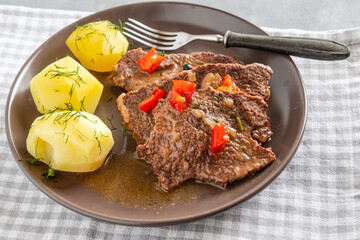 Homemade braised beef with gravy and potatoes