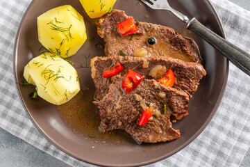 Homemade braised beef with gravy and potatoes