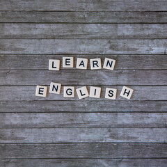 learn english word written on wooden background. learn english text on table, concept. Square instagram format