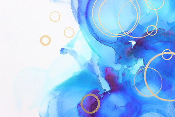 art photography of abstract fluid painting with alcohol ink, blue and gold colors