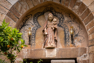 sculpture of the virgin over the entrance, Nativitat de la Mare de Déu church, Fornalutx,Mallorca, Balearic Islands, Spain