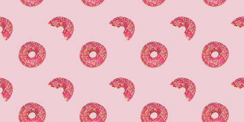 A seamless repeating pattern of a glamorous pink donut. Bright rose background with a bitten and whole doughnut.