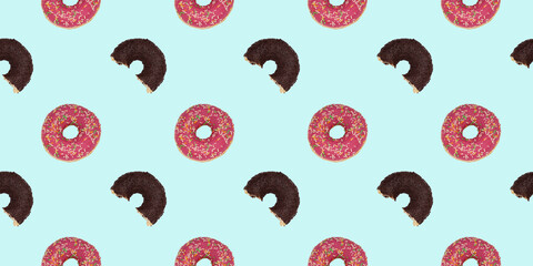 Seamless repeating pattern of a whole pink donut. Bright blue background with a bitten black...