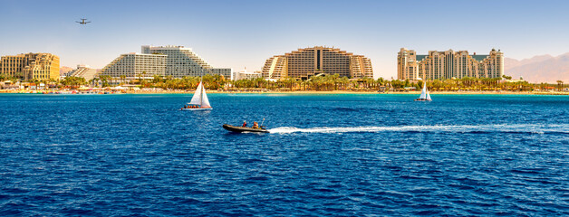 Fototapeta na wymiar Panoramic view on central public beach of Eilat – famous tourist resort city in Israel, Middle East
