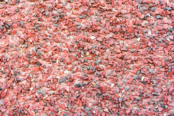 Wall paved with small red stones