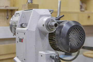 Industrial equipment in a small carpentry workshop. Manual production of wood and precious woods products