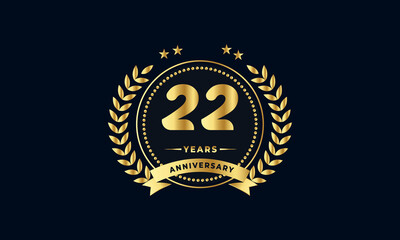 22th golden anniversary logo, with shiny ring and golden ribbon, laurel wreath isolated on navy blue background