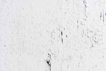 White wall with cracked paint