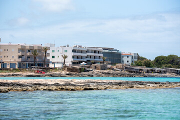 Fototapeta na wymiar View on the beach of Es Pujols in Formentera in summer 2021.