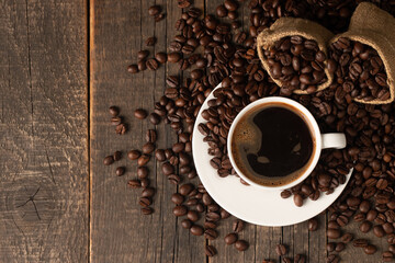 Coffee cup and beans on a rustic background. Espresso.