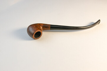Tobacco and tobacco pipes on a white background in the soft morning sunlight. Soft focus image

