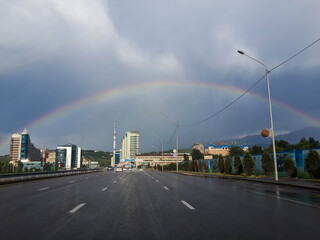 rainbow on the background of the city. rainbow after rain