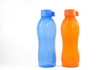 Orange and blue Tupperware water bottle in white background