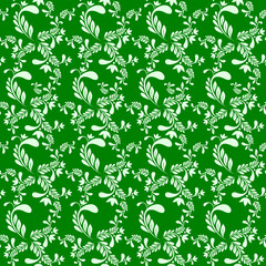 Abstract seamless pattern with a composition of silhouettes of flowers and leaves on a green isolated background. Decorative floral pattern in green tones.