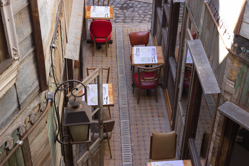 Fototapeta na wymiar Outdoor restaurant with empty tables.
