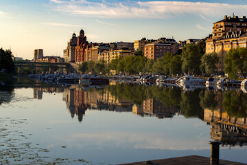 View of the city from the side of the sea bay against the background of the morning sky