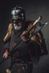 Naklejka premium Studio shot of antique old age viking with axe