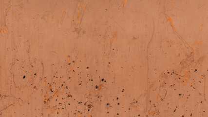 wall background with holes in a desaturated orange color