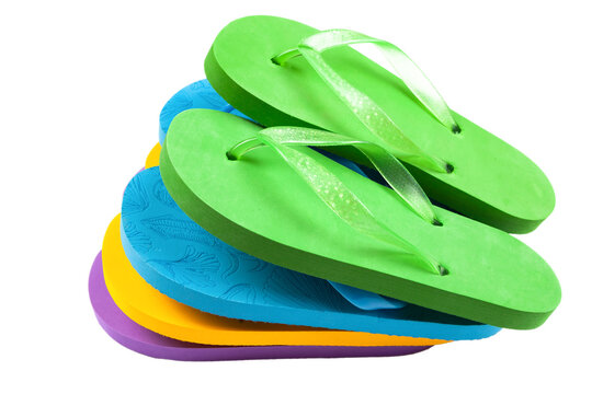 multi-colored rubber beach flip flops on a white background