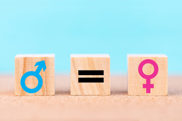 Concepts of gender equality. wooden cubes with symbol equal sign and male and female sign