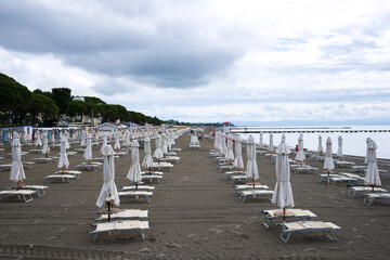 Grado, Italy. May 15, 2021 view of the beach with umbrellas and sunbeds of the city of Grado....