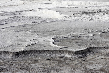 beautiful white fields of carbonated limestone formations in Pamukkale, Turkey