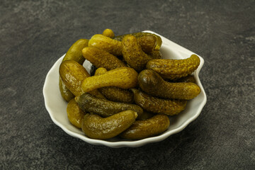 Pickled gherkin in the bowl