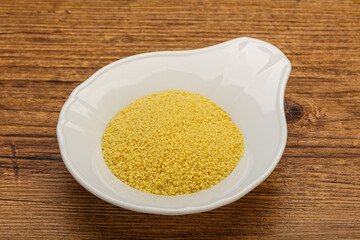 Raw cous cous heap in the bowl
