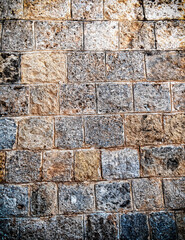 rough stone wall closeup, seamless pattern textured background, filtered image