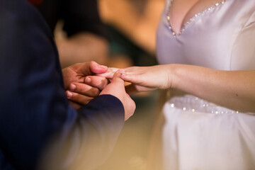 the time of the wedding ceremony when the bride and groom put the rings in hand