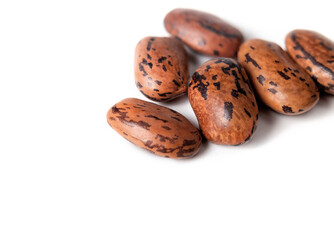 Dragon tongue bean seeds for planting in garden or eating. Macro. The Dutch heirloom bean plant produces yellow streaked with purple bean pods. Protein rich legume. Isolated on white. Selective focus.