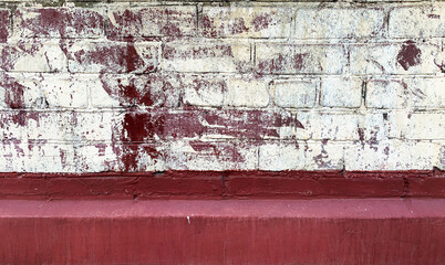 Background of texture of old colored brick. Photo walls of red, white, blue and green clinker...