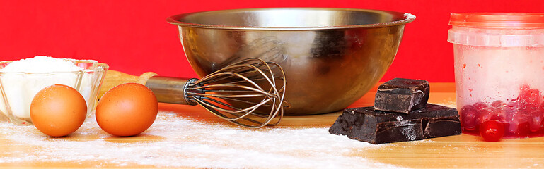 banner baking Cooking Ingredients Flour Eggs chocolate bar and candied cherries  On wood table. Cookies Pie Or Cake Recipe Mockup
