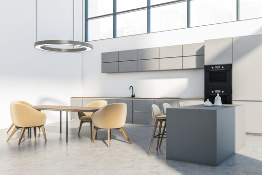Light kitchen interior with furniture on concrete floor and window