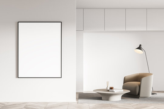 Minimalistic white living room interior with armchair, coffee table and vertical poster