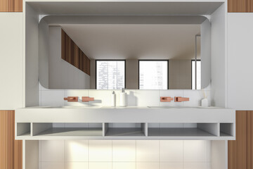 Modern design bathroom interior with double sink countertop, bronze faucets. Panoramic window with skyscrapers city view. Wood and white tile walls. Public wc hands wash concept.