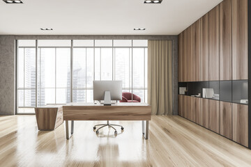 Luxury CEO office interior with table, computer and bookcase, front view