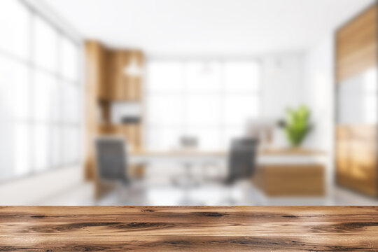 Wooden desk on blurred background of office manager business room