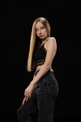 Fototapeta premium Studio, black background, top and jeans +
