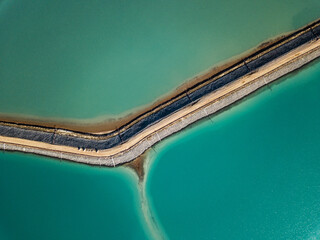 Abstract top down view of a large turquoise salt lake 