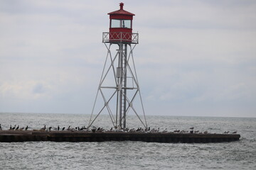 Fototapeta na wymiar lighthouse on the shore of the river