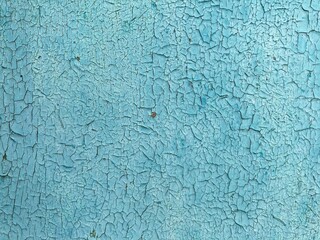 peeling blue paint on wooden background