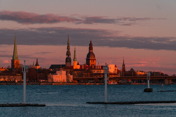 Fototapeta na wymiar Riga, Latvia. Golden sunset. Early summer, spring night. Orange, red skies.